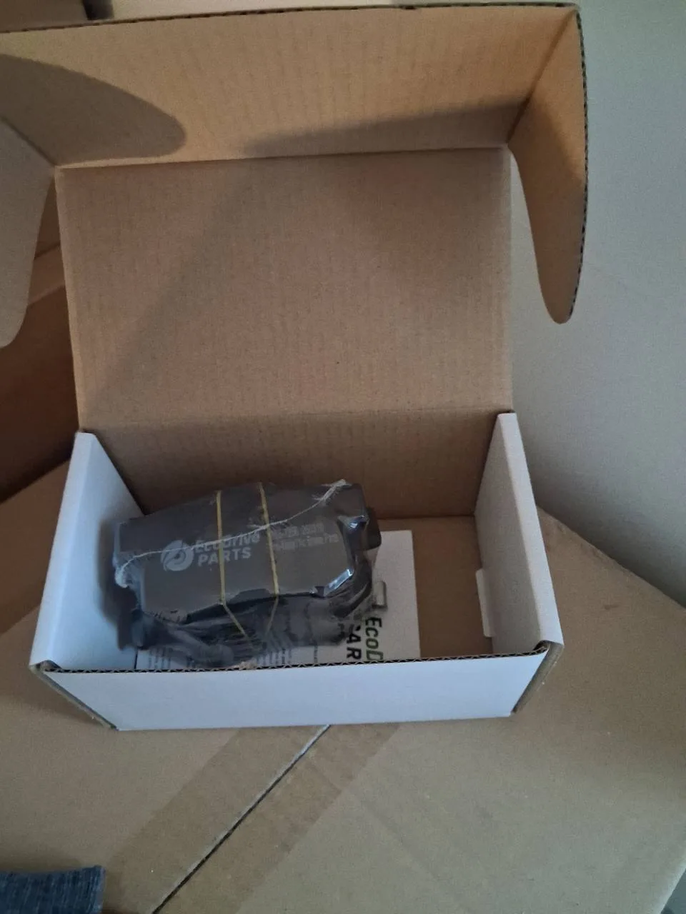 Owner-supplied example of EcoDrive pads and packaging in an open box